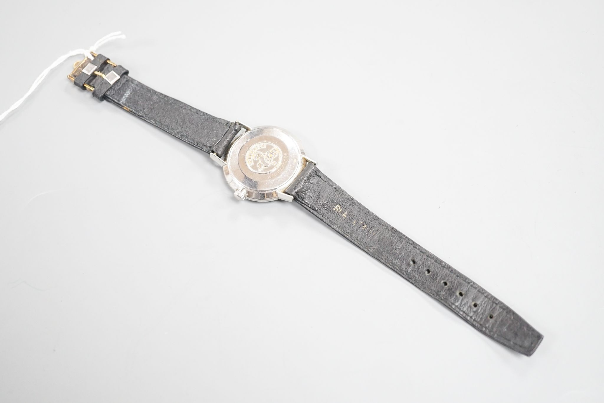 A gentleman's stainless steel Omega Seamaster manual wind wrist watch, on associated black leather strap, case diameter 35mm.